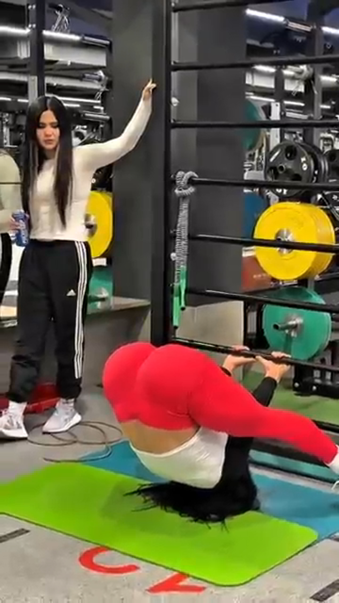 She Pulls Off the Ultimate Gym Trick—Watch What Happens When Her Friend Tries It!